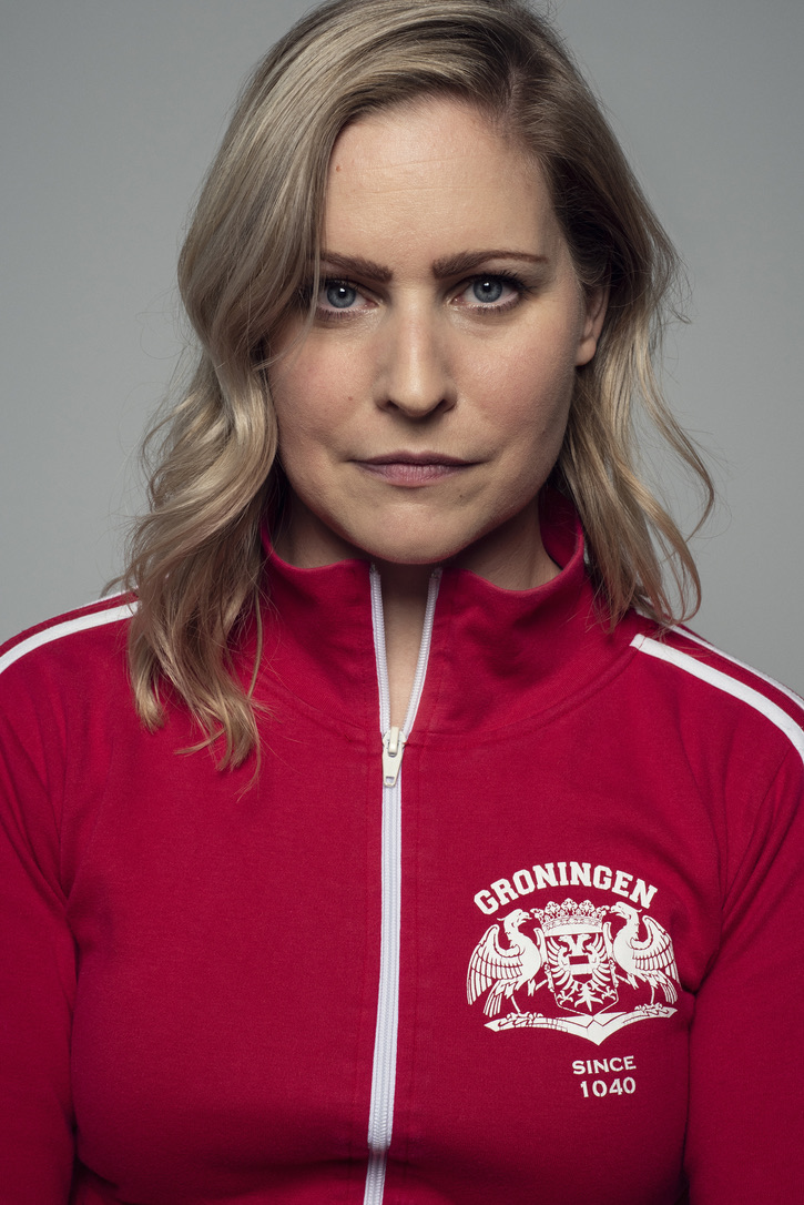 an image of Annie Lafleur staring into the camera in a red athletic wear top with white pipping and a white logo; image by Justine Latour © Le Quartanier.