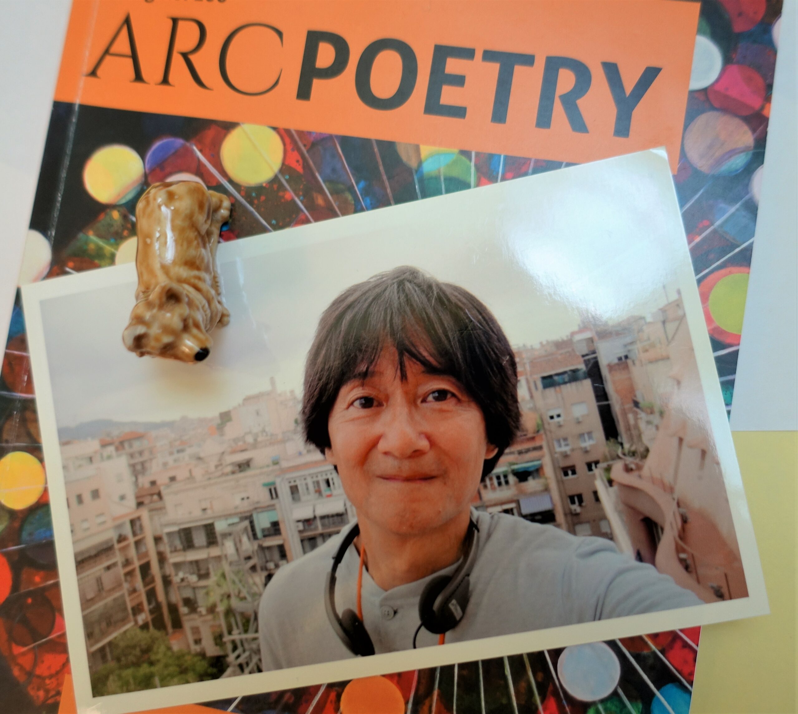 Kevin Irie's photo appears with an Award of Awesomeness doo-dad and issue #100 of Arc Poetry Magazine